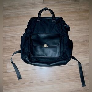 A new day laptop larger black backpack with multiple compartments